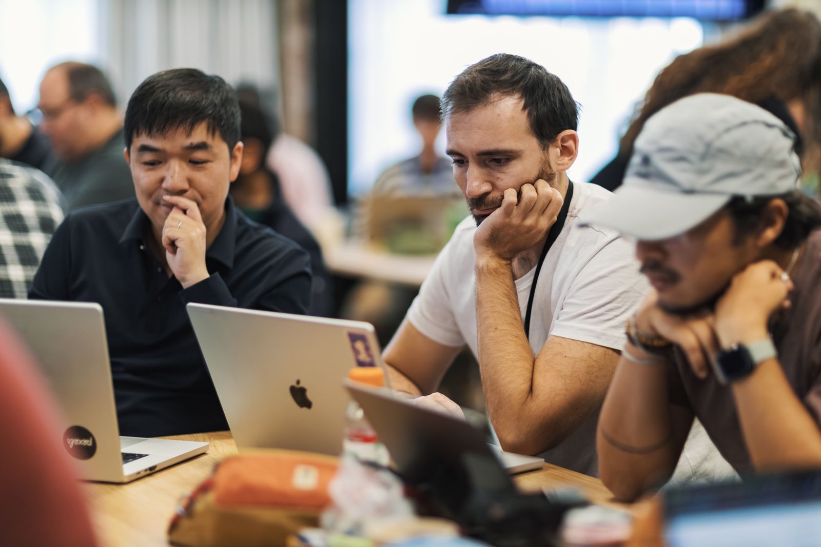 Engineers working together on laptops